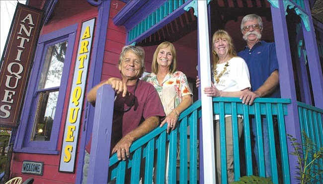 The Daily Courier/Nathaniel Kastelic
Daiton and Jacquie Rutkowski, along with Liz and Richard Long, owners of Artiques on McCormick Street in Prescott, pose in front of their shop Monday afternoon.
