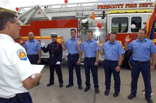 Prescott Fire Department’s Deputy Chief Bruce Martinez, left, swears in new engineers and firefighters. From left new engineers Allen Snyder and Dan Bates, and new firefighters Brady Brown, Jeremy Sarge, Nate Seets and Aaron Laipple.
