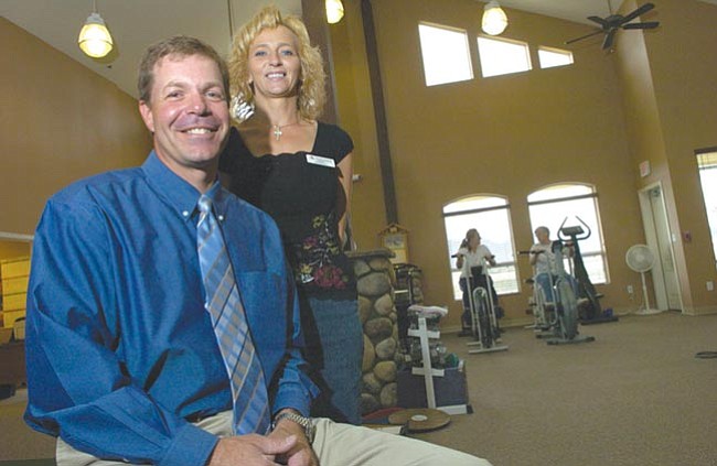Kurt Draper and Paula Lemmer, owners of Peak Performance Physical Therapy, pose in Prescott Valley Thursday.