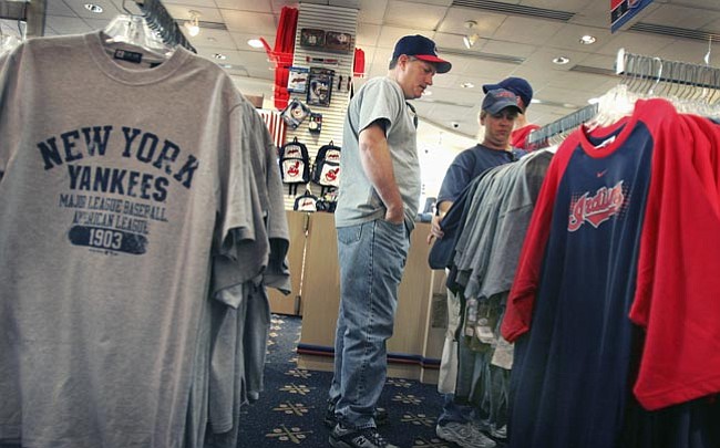 The Associated Press/<br>Chuck Crow<br>Team merchandise, the YES Network and, of course, the Yankees team itself could add up to the biggest sale in sports’ history – if recent speculation holds up.