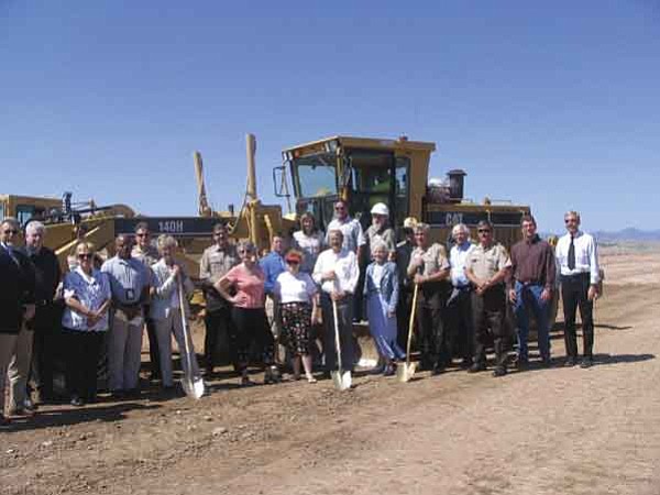 Officials with the Northern Arizona Regional Training Academy and county dignitaries pose at a groundbreaking ceremony for a training track at the Yavapai County Fairgrounds.