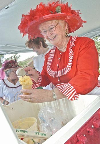 Maxine Dillahunty, president of The Prescott Victorian Society, serves up a double-scoop of ice cream at The Prescott Victorian Society’s Ice Cream Social at Sharlot Hall Museum in downtown Prescott Sunday.