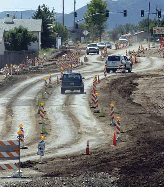 The Daily Courier/Jo. L. Keener
Cars meander through the construction zone on Robert Road Friday morning as the improvement project continues.