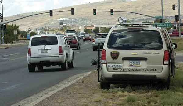 The Daily Courier/Jo. L. Keener 
One of the Prescott Valley Police Department photo enforcement vans monitors traffic at Highway 69 and Yavapai Road Friday morning. This is the first appearance of the van on state highways in Prescott Valley. The photo radar vehicle will issue warnings for the first 30 days, after the grace period, PVPD will issue citations.