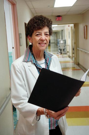 The Daily Courier/Jo. L. Keener
Jodie Williams reviews patient records while posing in the hallway at the VA Center Thursday. Williams was recently honored with the Outstanding Chapter President Award from the Arizona Nurses Association.