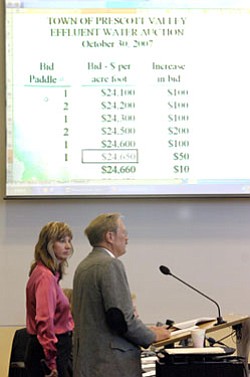 Prescott Valley Mayor Harvey Skoog conducts the bidding Tuesday morning as Colleen Auer, assistant city attorney looks on. The historic water auction will generate over $67 million for the Town of Prescott Valley.
<br><i>The Daily Courier/Jo.L. Keener
