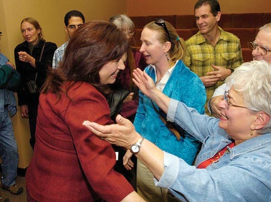 The Daily Courier/Jo. L. Keener
Jo Anne Luzius embraces Lora Lopas after Lopas wins a runoff election Tuesday night.

