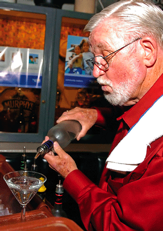 The Scene/Matt Hinshaw<p>
Don Shaffer, the United Way MC for the night, steps behind a bar and creates his “Don Shaffer Atomic Bomb” beverage.
