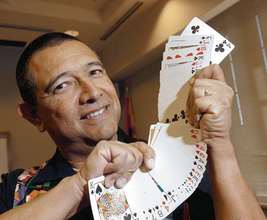 The Daily Courier/Jo. L. Keener<br>
Magician Eddie Siller displays a fanned deck of cards Thursday as he prepares for a show. Siller is a veteran Prescott police officer with nine years on the department.

