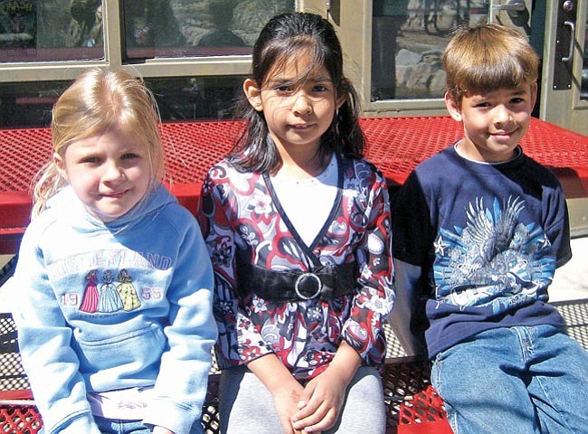 The Daily Courier/Ken Hedler
<br>
Kindergarten student Claire Marie Walker, left, and second-graders Natalie Claire Schulz and Matthew Gonzalez, all of Abia Judd Elementary School in Prescott, won at the state level for their entries in an art contest that the national Parent Teacher Association sponsors.