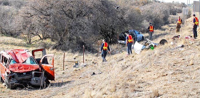 The Daily Courier/Matt Hinshaw<br>
Investigators begin to inspect the scene of a two-vehicle accident on Highway 89 and Perkins Drive in Prescott Friday afternoon.  Both people involved in the accident had to go by helicopter to the hospital.

