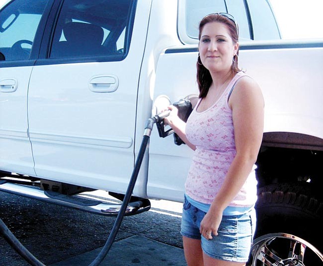 The Daily Courier/Jason Soifer
<br>

Misty Barnett got nearly seven gallons of gasoline for $25 for her Ford F150 truck Thursday afternoon. Barnett said it costs her $62 to fill up the truck’s tank.
