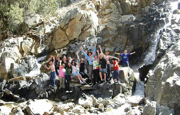 Courtesy/HCNH<p>
Highlands Center for Natural History Spring Break Camp participants revel beneath a 
seasonal waterfall along Lynx Creek below the Lynx Lake Dam this year.