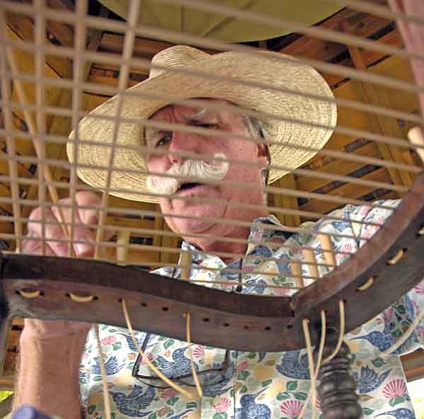 The Daily Courier/Jo.L.Keener<p>
Dennis O’Reilly canes a chair Saturday at the Sharlot Hall Folk Arts Festival. O’Reilly learned the skill from a minister more than 30 years ago, and he keeps the lost art alive in Prescott.