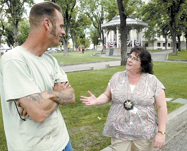Jo.L. Keener/The Daily Courier<br>
Terri Stasiuk, right, adult probation surveillance officer, meets with Michael Bethke Wednesday by the Yavapai County Courthouse Plaza.