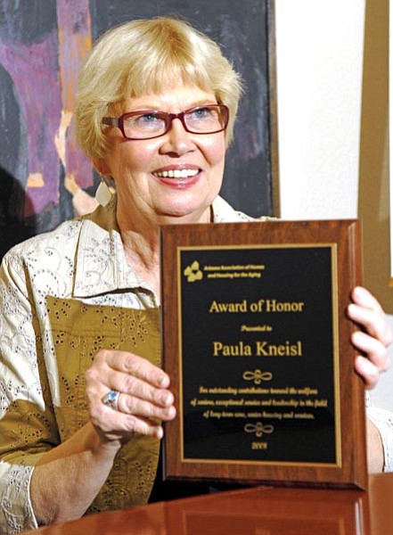 Jo. L. Keener/The Daily Courier<br>
Paula Kneisl poses with her award from the Honor of Aging Services of Arizona.