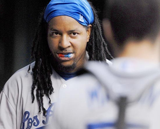 Kyle Ericson/<br>The Associated Press<br>Manny Ramirez got everthing he seemingly wanted in his trade to Los Angeles. His agent, Scott Boras, did, too.