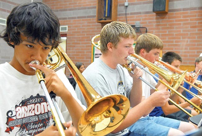 Matt Hinshaw/The Scene<p>
Charles Miller, 14, Cayden Webb, 17, Stephen Kozale, 14, and John Pearson, 15, play their trombones during Jazz Band rehearsal Friday afternoon at Prescott High School.