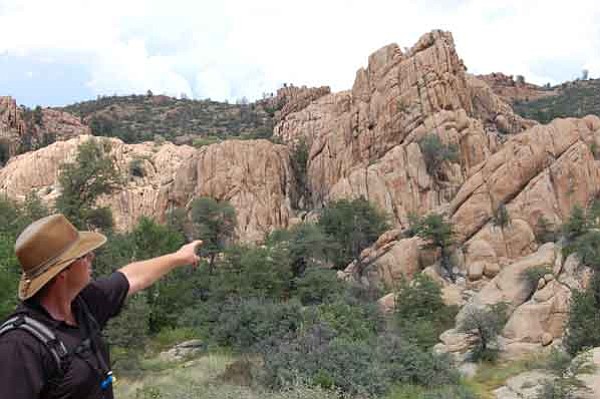 Cindy Barks/The Daily Courier
The city’s trails specialist Chris Hosking points out the area along the new Canyon and Basin trails that ultimately will link with a new parcel of land.

