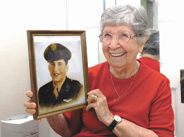 Jo. L. Keener/The Daily Courier<p>
Verna Martin displays a photo of her brother Sheldon Chambers as he appeared during WWII. Clayton Kuhles, whose hobby is searching Asia for plane wreckage, found Chambers’ remains in India.
