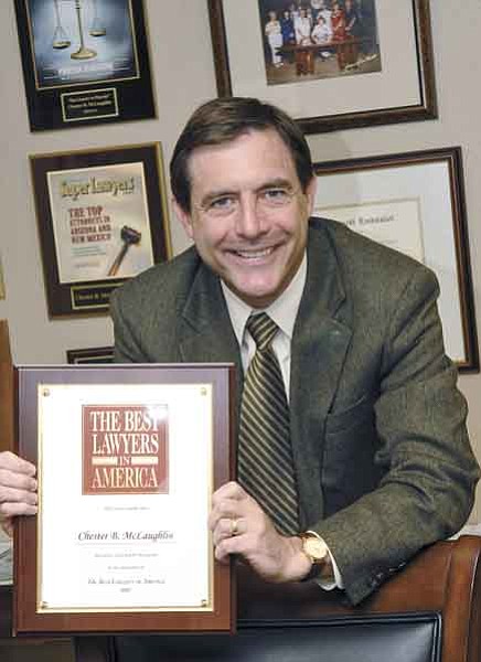 Jo. L. Keener/The Daily Courier<p>
Attorney Chester B. McLaughlin displays an award for his practice in elder law and his focus on working with seniors.
