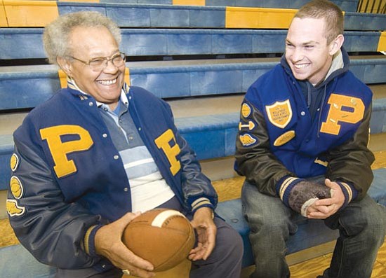 Les Stukenberg/<br>The Daily Courier<br>Charley Jones, left, and Brian Scates swapped stories of rushing lore when the two most prolific single-game rushers in PHS history met on Dec. 14.