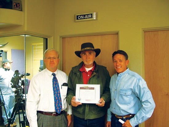 Courtesy<p>
Tom Henry (center) receives the Unsung Hero award.