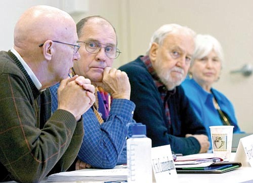 Matt Hinshaw/The Daily Courier<p>
Howard Moody, Ron Woemer and Riva Litt listen to Kirk Cunningham talk about the Retiree Connection program at Yavapai College Thursday morning.
