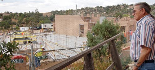 The Daily Courier/Joanna Dodder<p>
Yavapai-Prescott Indian Tribe elder Ted Vaughn watches construction of a new tribal administration building in October from the porch of the historic home of Sam and Viola Jimulla, his grandparents, who founded the reservation. 



