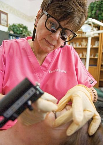 Matt Hinshaw/The Daily Courier<p>
Barbara Denny, owner of Barbara Denny’s Permanent Cosmetics & Skin Care Solutions, applies permanent makeup on Rowena Craighead Wednesday morning in Prescott.  


