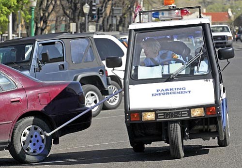 Courier file photo<p>
Drivers who overstay their parking time limit in downtown Prescott will be facing higher fines soon. Beginning May 1, the city’s parking enforcement program, shown here in a Courier file photo, will begin charging $20 for a parking violation – up from the $10 that has been in effect for years.
