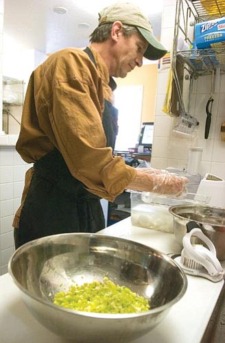 Matt Hinshaw/The Daily Courier<p>
Todd Bulock, the chef at Rooster’s of Prescott, cracks open a hard-boiled egg while making fresh egg salad before the lunch rush Tuesday morning in Prescott.
