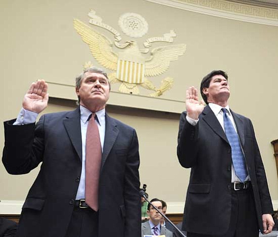 Susan Walsh/<br>The Associated Press<br>ACC Commissioner and Bowl Championship Series coordinator John Swofford, left, and West Mountain Conference Commissioner Craig Thompson, right, are sworn in before giving their testimony before the House Commerce, Trade, and Consumer Protection Subcommittee hearing on the BCS on Capitol Hill May 1.
