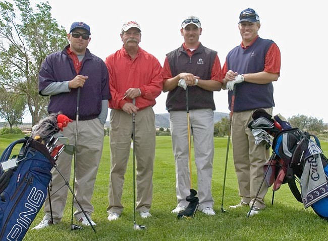 Matt Hinshaw/The Daily Courier
Left to right, Ryan, Bob, Jay Bibich, and Paul Clark prepare to play in the 50th Annual Father and Son Golf Tournament Saturday morning at Antelope Hills Golf Course in Prescott. Ryan and Jay's father and Paul's stepfather, Joe Bibich, died recently and they decided to play with their Uncle Bob in Joe's memory.
