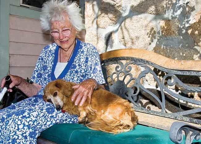 Matt Hinshaw/The Daily Courier<br>
Hazel Deming, 96, pets her dachshund Patty at her home in the Granite Dells in Prescott. She has lived in this home for more than 70 years.