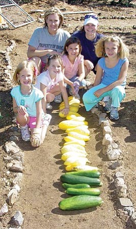 Courtesy photo<p>
Volunteers (front, left to right) Shae Champlin, Allison Miller, Kayla Champlin and Jessi Miller and (back) Trisha Champlin and Shannon Gansz harvested vegetables from the community garden at Heritage Park Zoological Sanctuary.