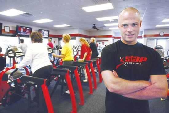 Les Stukenberg/<br>The Daily Courier<br>Keith Conrad, seen in this file photo when he first opened Snap Fitness on Willow Creek Road in early 2008, has opened two other locations since then.