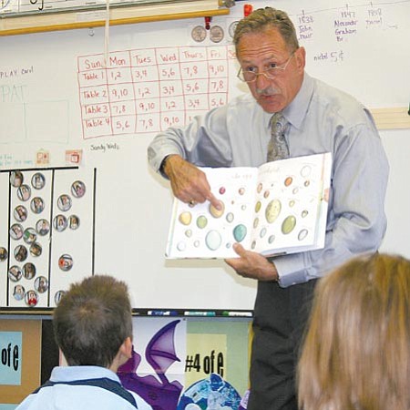 Sue Tone/<br>Special to the Courier<br>Henry Schmitt, seen reading to second- graders at Coyote Springs Elementary School, will receive the Arizona School Administrators large district Superintendent of the Year award this Thursday in Phoenix.
