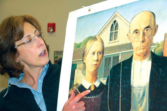 Bruce Colbert/The Daily Courier<p>
Roseann Lukaszewski of the Prescott Art Docents explains to children the importance of lines, shapes, forms and color values in art, using Grant Wood's famous painting "American Gothic."
