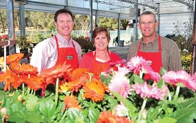 Les Stukenberg/The Daily Courier<br/>Watters Garden Centers owners Ken and Lisa Lain and General Manager Brad DeKruyter take pride in Watters being named the Revolutionary 100 National Winner by Today’s Garden Center magazine.<br/>