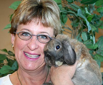 Courtesy photo<br />Dori Carpenter snuggles up to certified therapy rabbit Luigi. Carptenter says rabbits need special care, handling and training, and should not be an impulse buy.