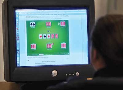 Matt Hinshaw, illustration/The Daily Courier<br>
Online gambling, such as poker, actually is illegal.