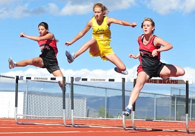 Les Stukenberg/The Daily Courier<br /><br /><!-- 1upcrlf2 -->From left: Bradshaw Mountain’s Jordyne Duncan, Prescott High’s Kelcey Harris and BMHS’s Brittany Schmidt compete in the 100-meter hurdles in a dual meet at Bradshaw Mountain on Wednesday.