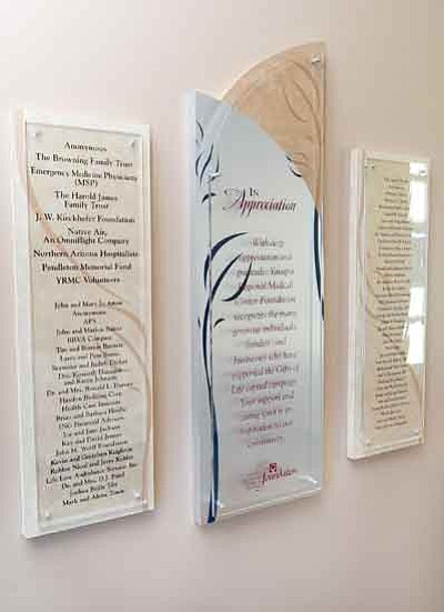 Les Stukenberg/The Daily Courier<p>Numerous donors who contributed to YRMC’s new Birthing Center are commemorated on glass plaques.