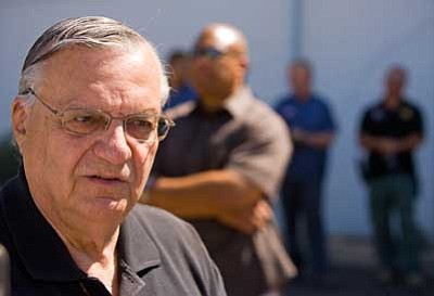 Michael Schennum/The Arizona Republic, AP<br>Maricopa County Sheriff Joe Arpaio speaks with the media after an immigration raid on a business in west Phoenix on Thursday.