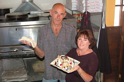 Jason Soifer/The Daily Courier<br>
Don and Barbara Stedman pose in their new Italian restaurant in Dewey Monday afternoon.  Menu items include pizza, pasta, appetizers, sandwiches and desserts.














