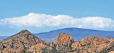 Matt Hinshaw/The Daily Courier<br>
Clouds build up over the Black Hills Tuesday afternoon. The clouds are a sign that monsoon weather patterns are starting to build in Arizona.
