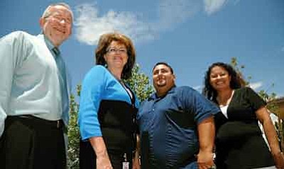 Brett Soldwedel/The Daily Courier<br>Wayne Tormala, left, chief of the Bureau of Tobacco and Chronic Disease; Laurie Thomas, marketing manager for Maricopa County Department of Health; Ben Palmer, marketing project specialist for the Bureau of Tobacco & Chronic Disease; and Carol Lewis, community health education coordinator for Yavapai County Community Health Services, all help with smoking cessation and the ASHLine program.