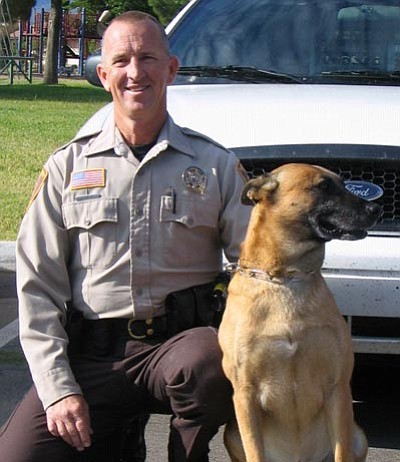 YCSO/Courtesy<br>Sheriff’s Deputy Harry Shrum adopted K-9 Aros, who was recently retired from the YCSO.
