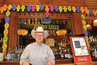Matt Hinshaw/The Daily Courier<br>
Tommy Meredith, owner of the Jersey Lilly Saloon, stands behind his bar Wednesday afternoon in Prescott.  The Jersey Lilly Saloon is raising money to donate to the Yavapai County Courthouse Christmas lighting.  Donations are accepted in $5, $10, $25, $50, and $100 denominations.
